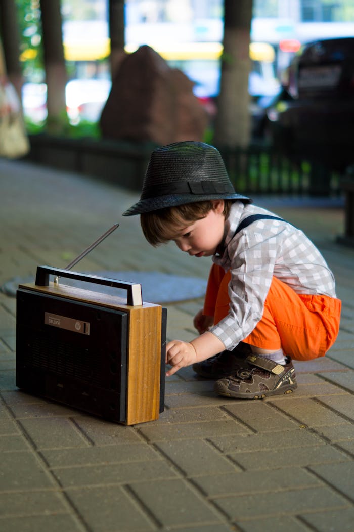 Boy Tuning Transistor Radio